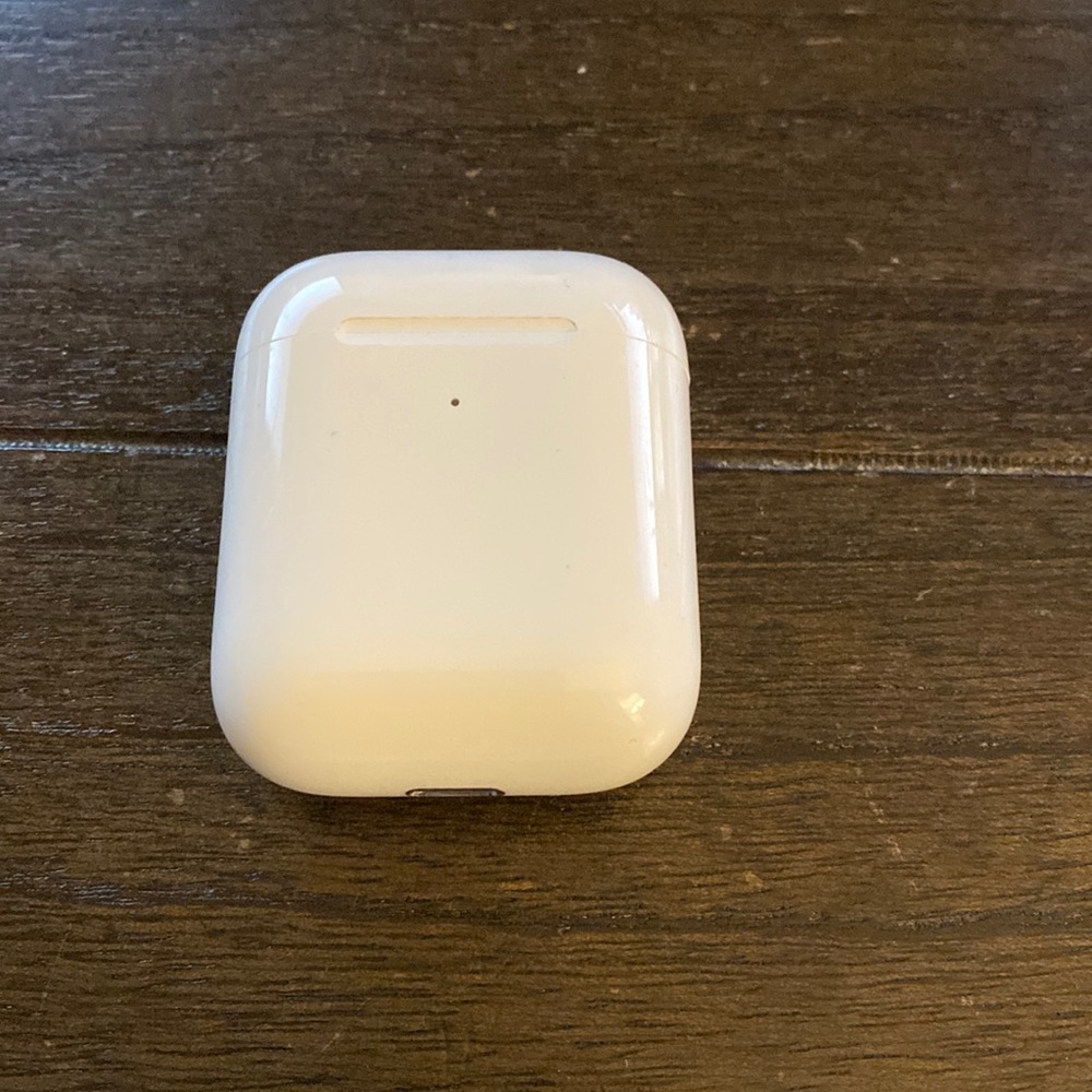 Apple AirPods with wireless charging case.